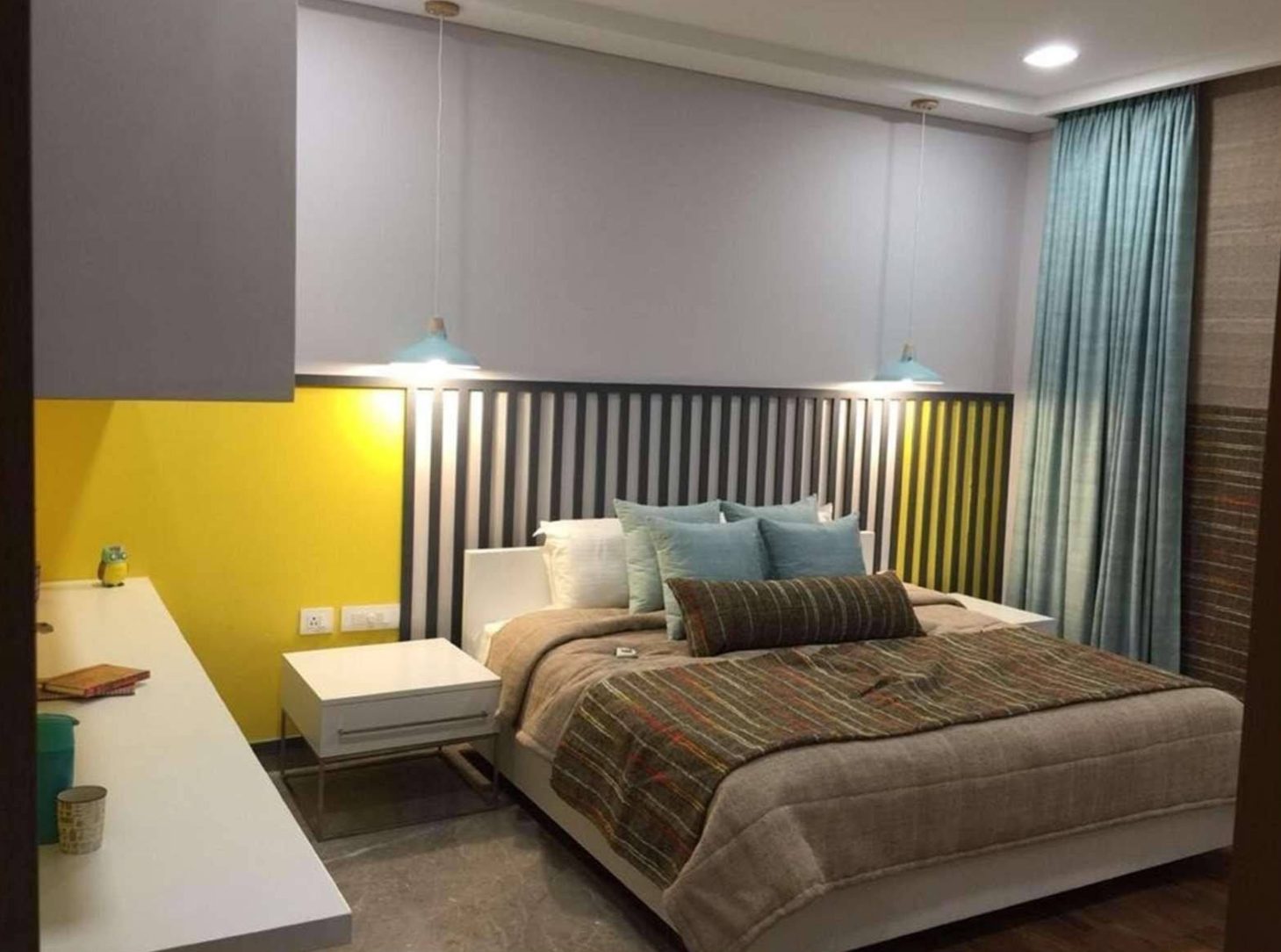 Bedroom with yellow accent wall